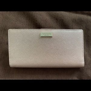 Kate Spade wallet in dull pink color